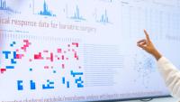 A doctor reviewing clinical data